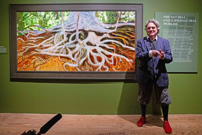 Artist Jamie Wyeth stands before his painting entitled Roots Revisited during the press preview of his new exhibition Jamie Wyeth: Unsettled at the Brandywine Museum of Art in Chadds Ford, Pa., Friday, March 15, 2024. The exhibit features more than 50 works drawn from museum and private collections across the country "trace a persistent vein of intriguing, often disconcerting imagery," over Wyeth's career.