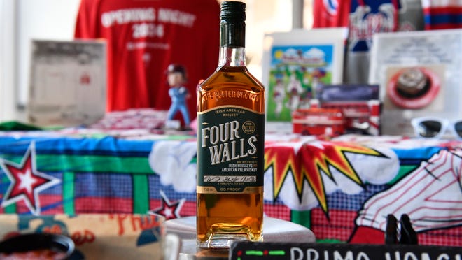 A bottle of Four Walls Irish American whiskey is displayed during an event to highlight what is new for the 2024 Philadelphia Phillies season at Citizens Bank Park in Philadelphia on Monday, March 25, 2024.