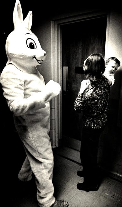 A toddler is not sure what to think about this Easter Bunny in 1976.