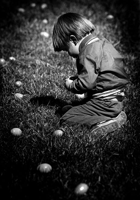Allen Sylvester, 2, decides to stop and eat some eggs during the hunt at his home in 1985.