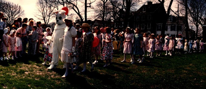The Easter Bunny leads children in an Easter parade on the Green in New Castle in 1993.