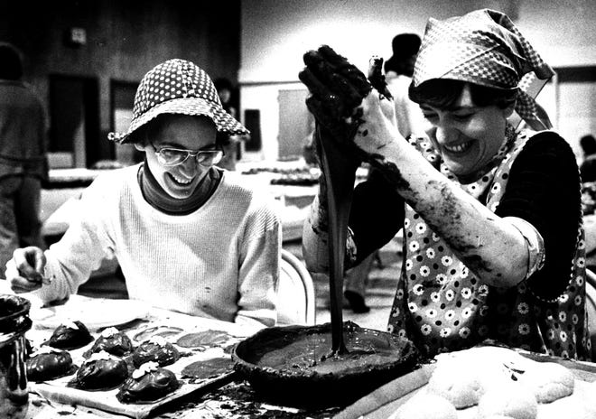 Marian Wangsgard watches Loretta Rice dip chocolate eggs in Wilmington in 1977.