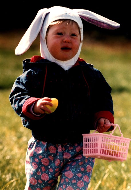 Nicole McCoy, 18-months, hunts for Easter eggs at the Kings Croft and Scarborough Manor Developments hunt in Bear in 1995.