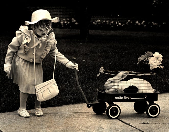 Kelly Brooks of Newark pulls her bunny into the Rehoboth Convention Center in 1987 for the Easter Parade.
