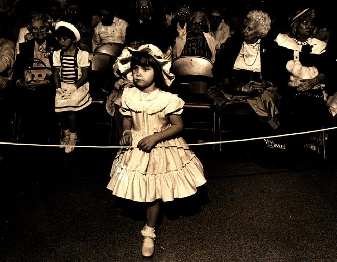 Christine Taylor, 5, of Rehoboth Beach, waits to collect her trophy for the Easter Parade in Rehoboth Beach in 1987.