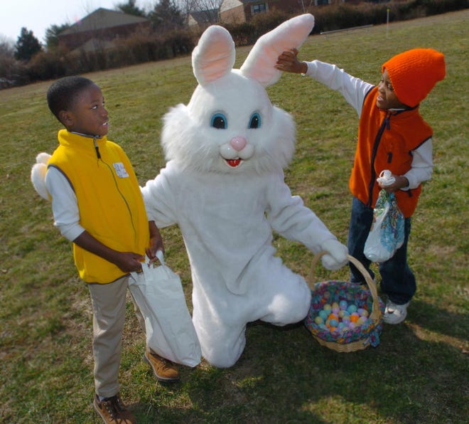 Michael Flamer, 8 of Felton, watches as six-year-old brother Anthony Flamer pulls on the Easter Bunny's ear after the Dover Parks and Recreation Annual Egg Hunt in 2005.