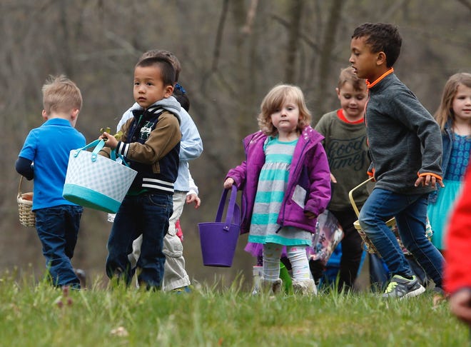 Brian Hui, of Hockessin, (left) joins other 3- and 4-year-olds in the Easter egg hunt at Auburn Heights Preserve in 2018.
