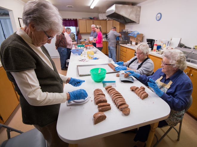 Pat Bravata, left, of Woodside, Diane Leech, of Millersburg, Pa. and Audrey Auras, of Woodside, shape Easter eggs at Woodside United Methodist Church in 2016, where they have been making quarter-pound easter eggs for decades.