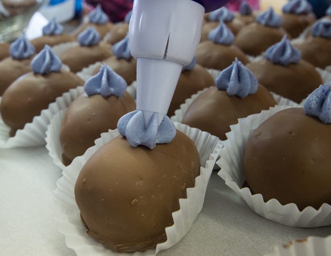 Icing is added to Easter eggs at Woodside United Methodist Church in 2016.