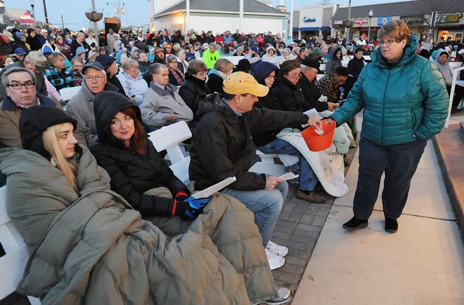 In Rehoboth Beach, attendees bundled up during chilly weather for the Easter Sunrise Service at the Bandstand in 2015.