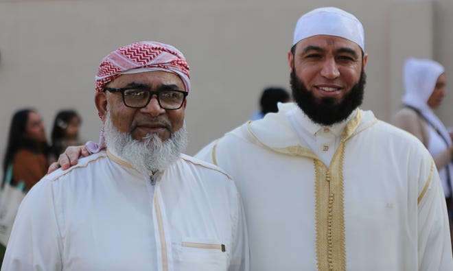 Bma Belal (left) and Imam Hadi pose for a photograph during Eid al-Fitr on Wednesday April 10, 2024.