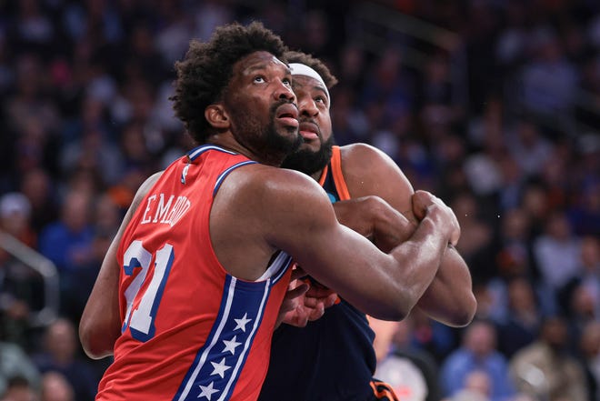 Philadelphia 76ers center Joel Embiid (21) battles for position against New York Knicks center Mitchell Robinson (23) during the second half of Game 2 of the first round of the 2024 NBA playoffs at Madison Square Garden.