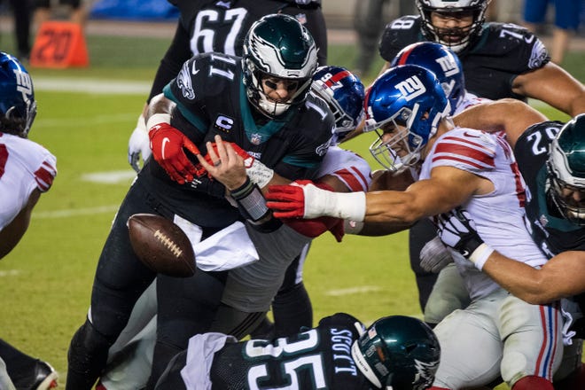 Eagles' Carson Wentz (11) loses the ball against the Giants Thursday, Oct. 22, 2020 in Philadelphia, Pa.
