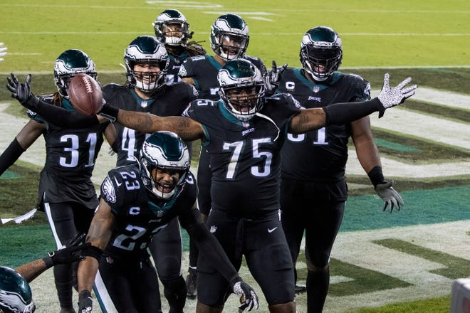 Eagles players celebrate in the end zone following a Giants' fumble to seal the game Thursday, Oct. 22, 2020 in Philadelphia, Pa. The Eagles won 22-21.