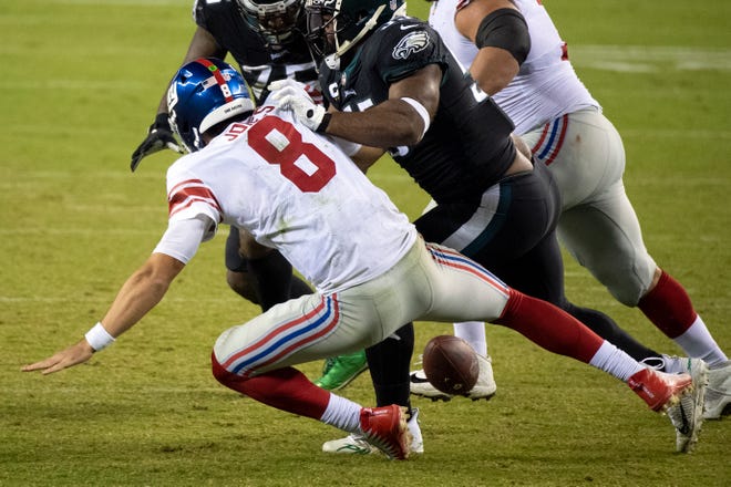Giants' Daniel Jones (8) fumbles the ball late in the fourth quarter to seal an Eagles' victory Thursday, Oct. 22, 2020 in Philadelphia, Pa.