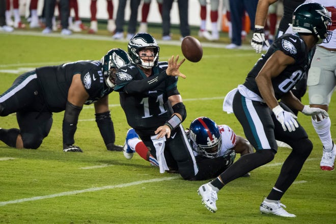 Eagles' Carson Wentz (11) attempts a pass but is ruled down against the Giants Thursday, Oct. 22, 2020 in Philadelphia, Pa.