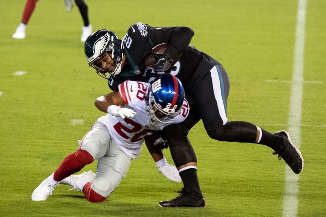 Eagles' Richard Rodgers (85) is tackled by Giants' Julian Love (20) in Philadelphia, Pa. on Thursday, Oct. 22, 2020.