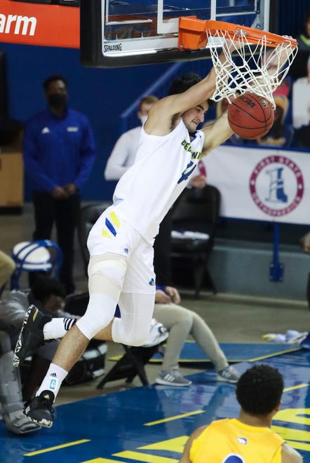 Delaware's Gianmarco Arletti slams in the second half of the Blue Hens' 74-56 win at the Bob Carpenter Center Friday, Jan. 15, 2021.