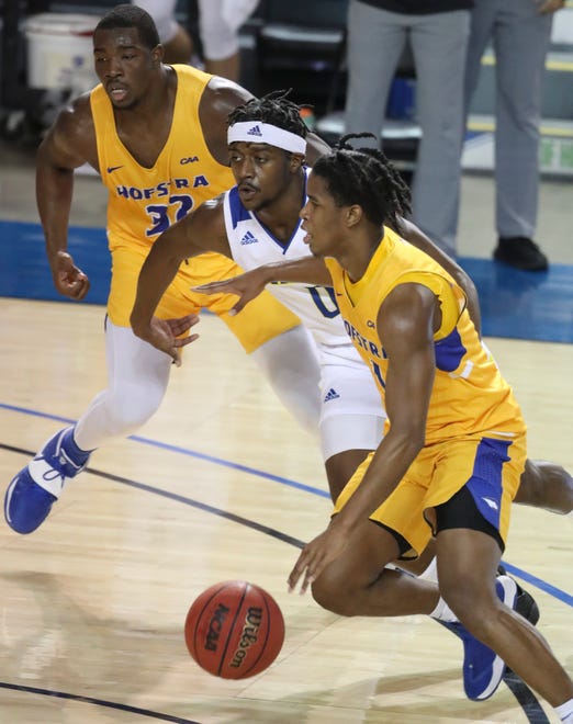 Delaware guard Ryan Allen defends between Hofstra's Isaac Kante (left) and Caleb Burgess in the first half of the Blue Hens' 74-56 win at the Bob Carpenter Center Friday, Jan. 15, 2021.